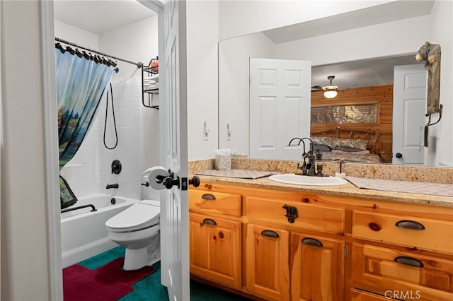 full bathroom with vanity, shower / tub combo, ceiling fan, and toilet