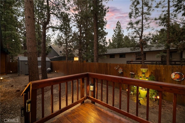 deck at dusk with a shed