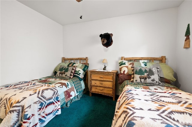 bedroom featuring ceiling fan and dark carpet