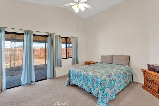 bedroom featuring ceiling fan, light colored carpet, vaulted ceiling, and access to outside