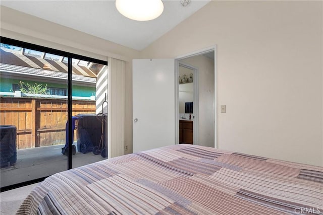 carpeted bedroom featuring lofted ceiling and a closet