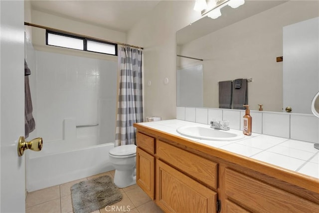 full bathroom with tile patterned floors, toilet, shower / tub combo, and vanity