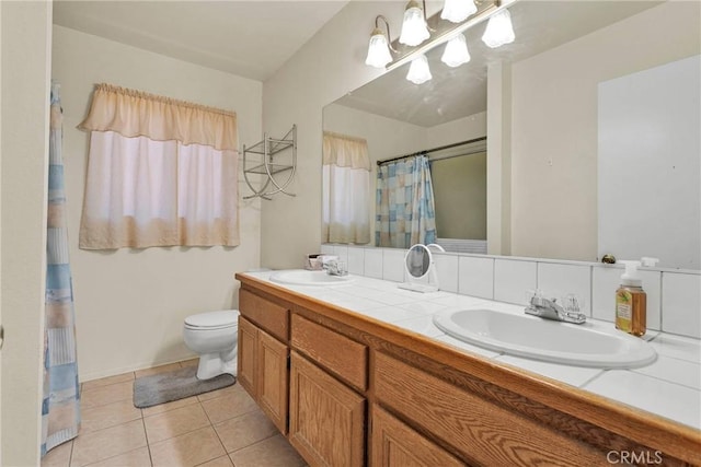 bathroom featuring a shower with shower curtain, vanity, toilet, and tile patterned flooring