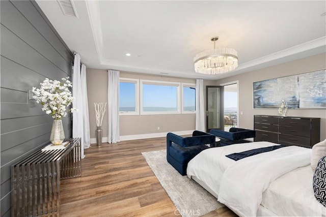20436 W Liverpool Way, Porter Ranch, CA 91326 - bedroom featuring a tray ceiling, wood finished floors, a chandelier, baseboards, and recessed lighting