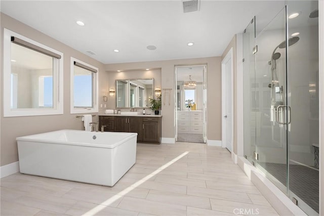 20436 W Liverpool Way, Porter Ranch, CA 91326 - full bathroom with a stall shower, plenty of natural light, vanity, baseboards, and recessed lighting
