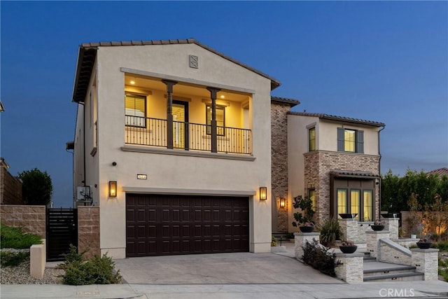 20436 W Liverpool Way, Porter Ranch, CA 91326 - mediterranean / spanish house with a balcony, stucco siding, a garage, concrete driveway, and fence