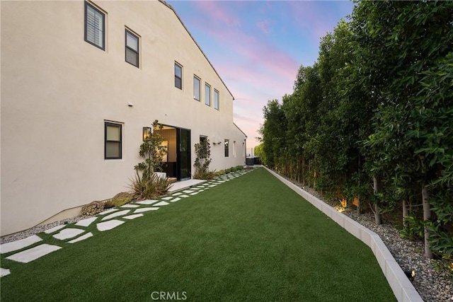 20436 W Liverpool Way, Porter Ranch, CA 91326 - yard at dusk featuring a lawn