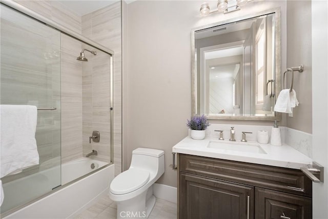 full bathroom featuring vanity, enclosed tub / shower combo, and toilet