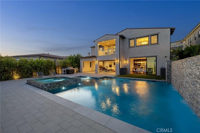 20436 W Liverpool Way, Porter Ranch, CA 91326 - view of pool with a pool with connected hot tub, a patio area, and central air condition unit