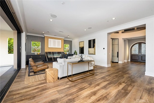20436 W Liverpool Way, Porter Ranch, CA 91326 - living area featuring ornamental molding, wood finished floors, baseboards, recessed lighting, and french doors