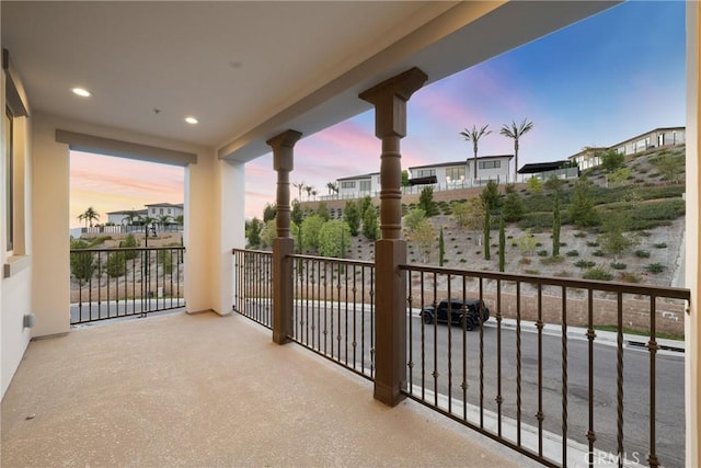 view of balcony at dusk