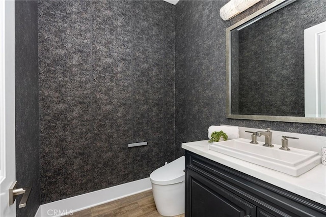 20436 W Liverpool Way, Porter Ranch, CA 91326 - half bathroom featuring wood finished floors, toilet, and vanity