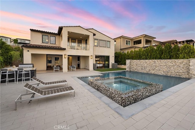 20436 W Liverpool Way, Porter Ranch, CA 91326 - outdoor pool featuring an in-ground hot tub, a patio area, outdoor lounge area, an outdoor bar, and an outdoor kitchen