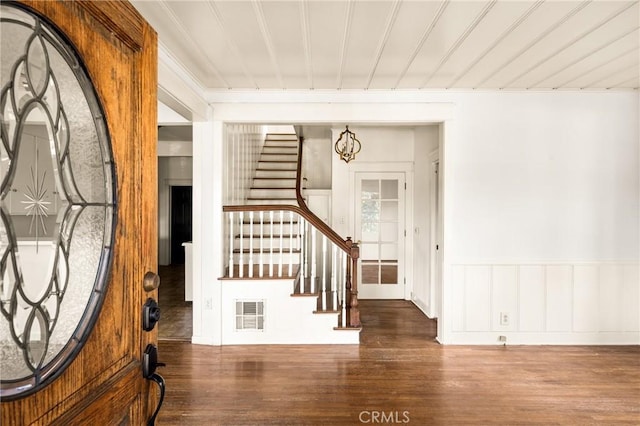 entrance foyer with dark hardwood / wood-style flooring