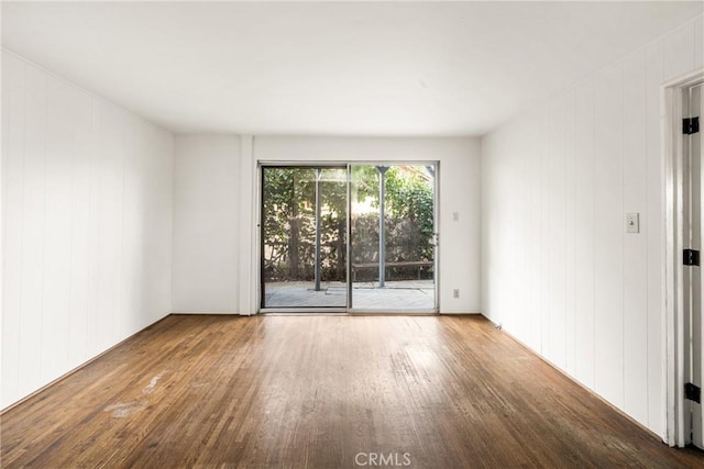 unfurnished room featuring wood-type flooring