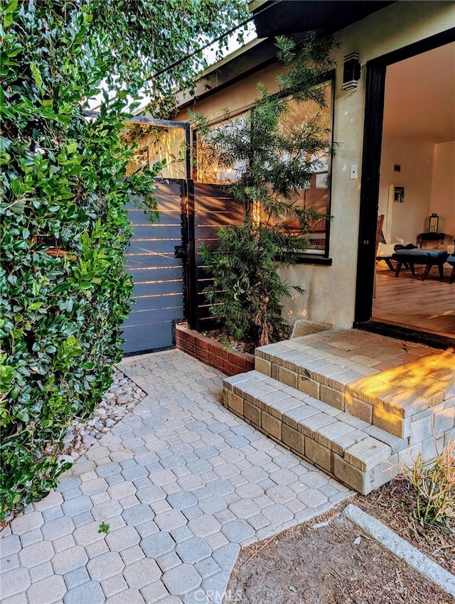 entrance to property with a patio area