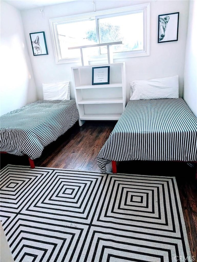 bedroom featuring dark wood-type flooring