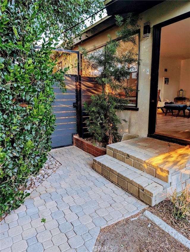 doorway to property with a patio