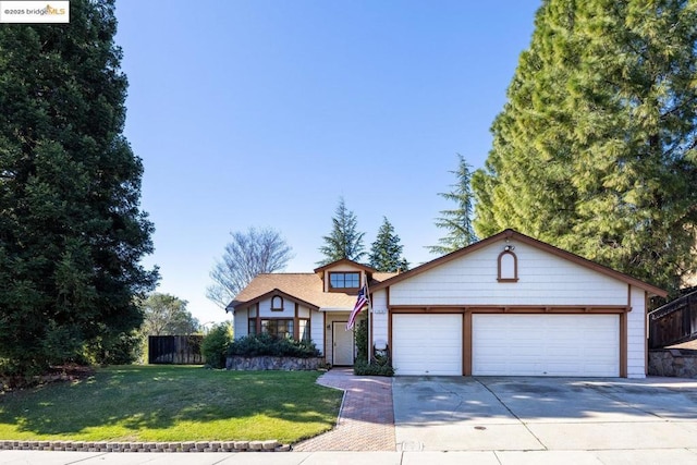 view of front of property featuring a garage and a front lawn