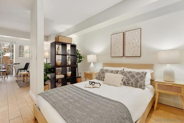 bedroom with light hardwood / wood-style floors