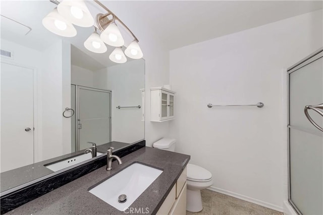 bathroom with visible vents, a chandelier, toilet, a shower with shower door, and vanity