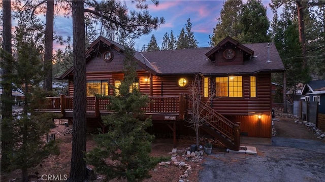 cabin with a wooden deck