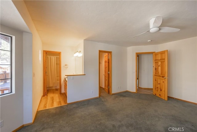 empty room with light carpet and baseboards