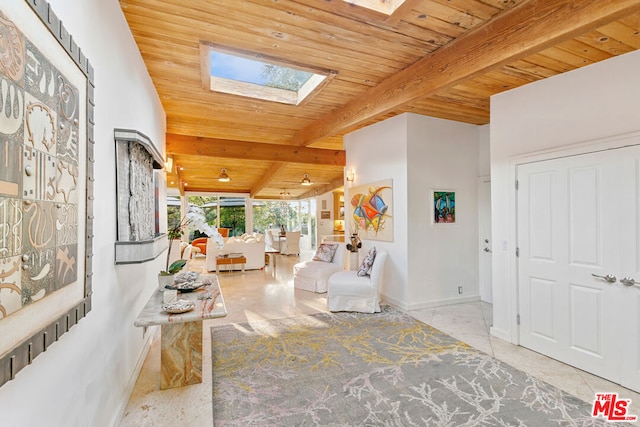 hallway with wood ceiling and lofted ceiling with skylight