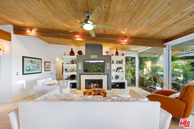 living room with a tiled fireplace, ceiling fan, wood ceiling, and beamed ceiling