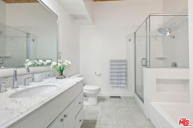 full bathroom with vanity, plus walk in shower, and toilet