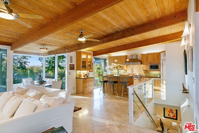 living room featuring wood ceiling, ceiling fan, beam ceiling, and light tile patterned floors