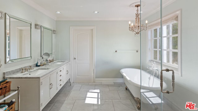 bathroom featuring tile patterned flooring, a bathing tub, vanity, ornamental molding, and a chandelier