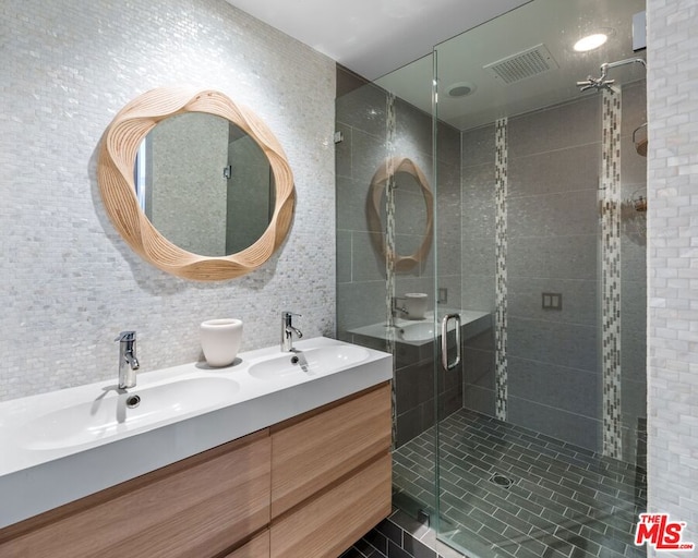 bathroom featuring walk in shower and vanity