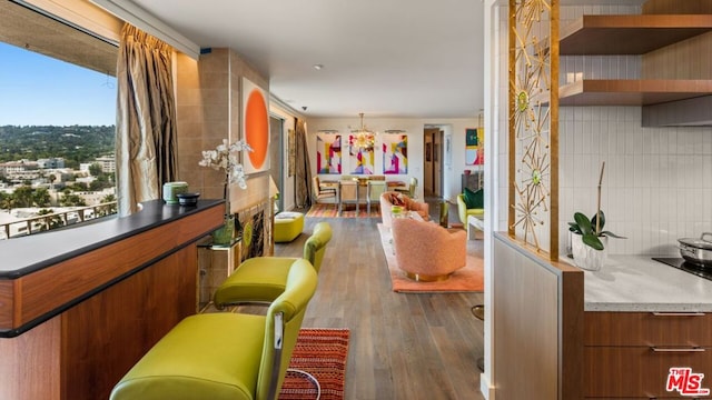 interior space with dark hardwood / wood-style flooring and decorative backsplash