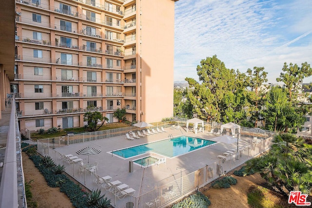 view of swimming pool featuring a patio area