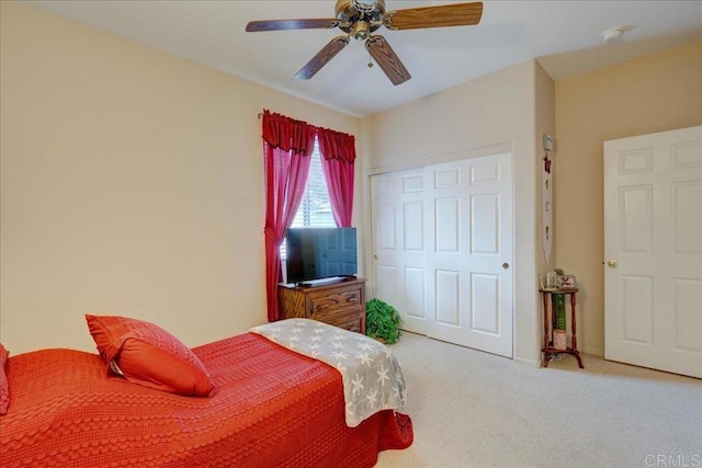 bedroom featuring carpet floors, a closet, and ceiling fan