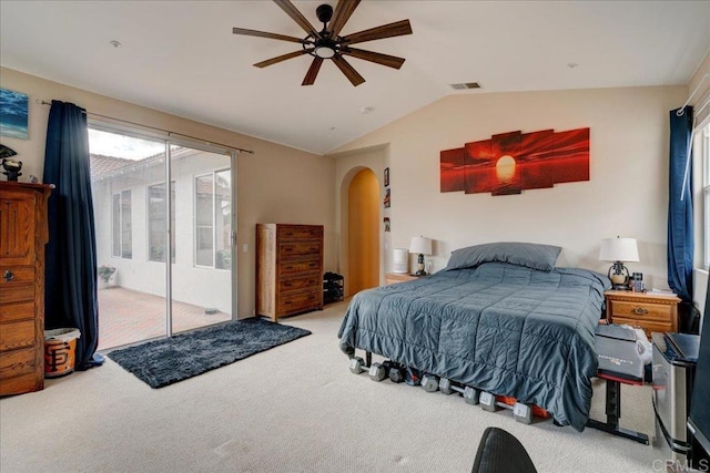 bedroom featuring vaulted ceiling, light carpet, access to exterior, and ceiling fan