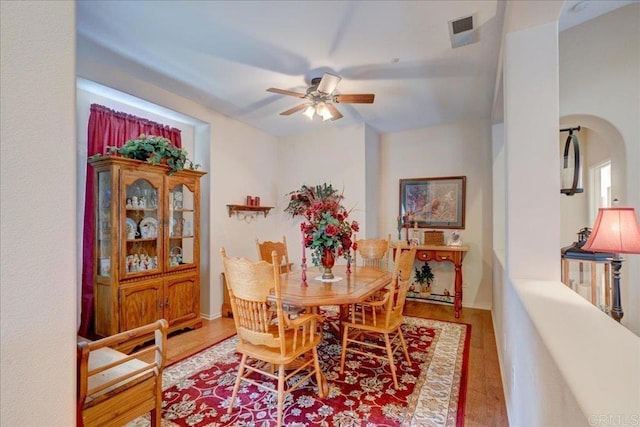 dining room featuring wood-type flooring and ceiling fan