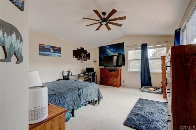 bedroom with vaulted ceiling, carpet floors, and ceiling fan