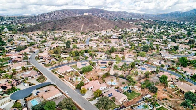 birds eye view of property featuring a mountain view