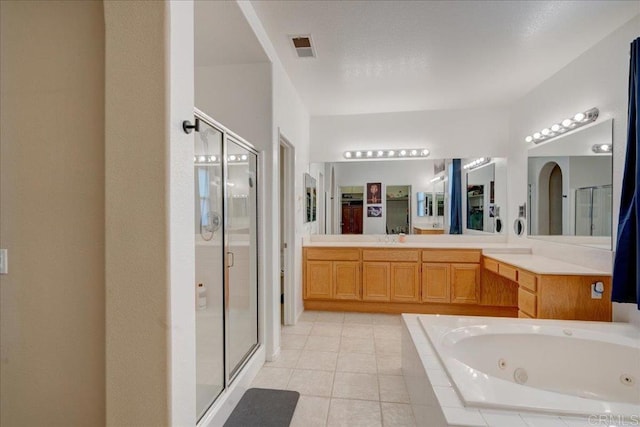 bathroom featuring vanity, tile patterned flooring, and independent shower and bath