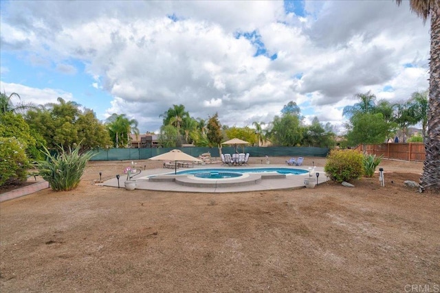 view of swimming pool with a patio