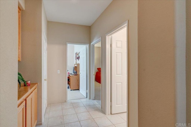 corridor with light tile patterned floors