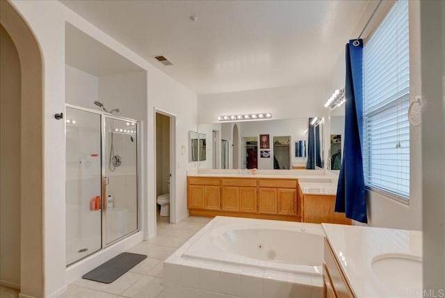 full bathroom with toilet, tile patterned floors, vanity, and shower with separate bathtub