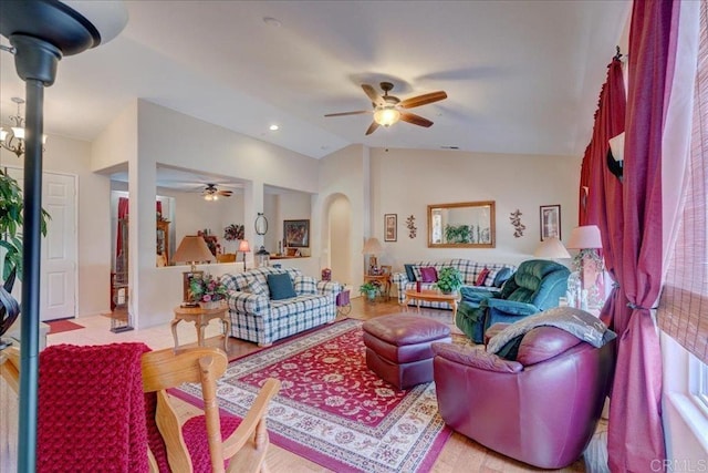 living room with vaulted ceiling and ceiling fan