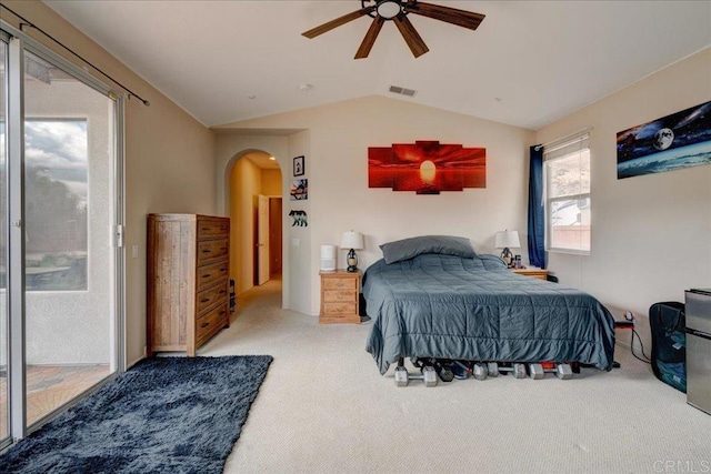 carpeted bedroom with ceiling fan, lofted ceiling, and access to exterior