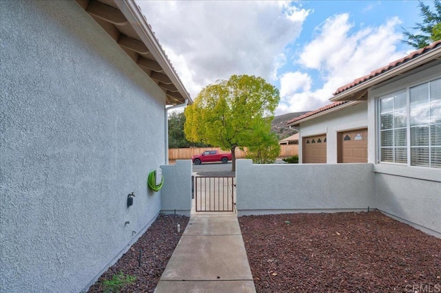 view of side of property featuring a garage