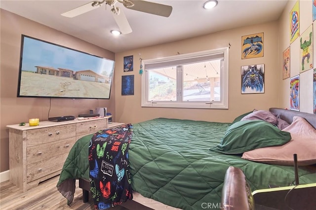 bedroom featuring wood-type flooring and ceiling fan