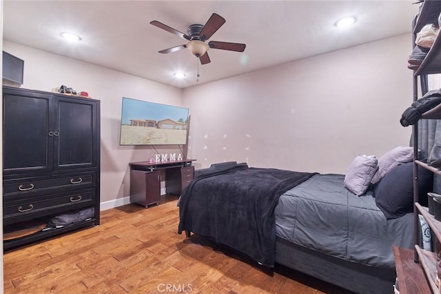 bedroom featuring ceiling fan and light hardwood / wood-style floors