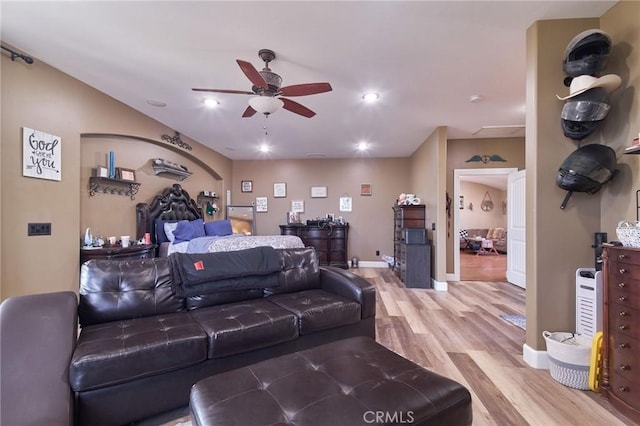 bedroom featuring ceiling fan and light hardwood / wood-style floors